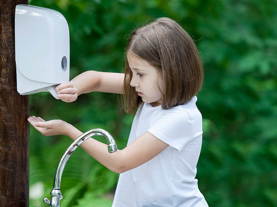 kid washing her hands