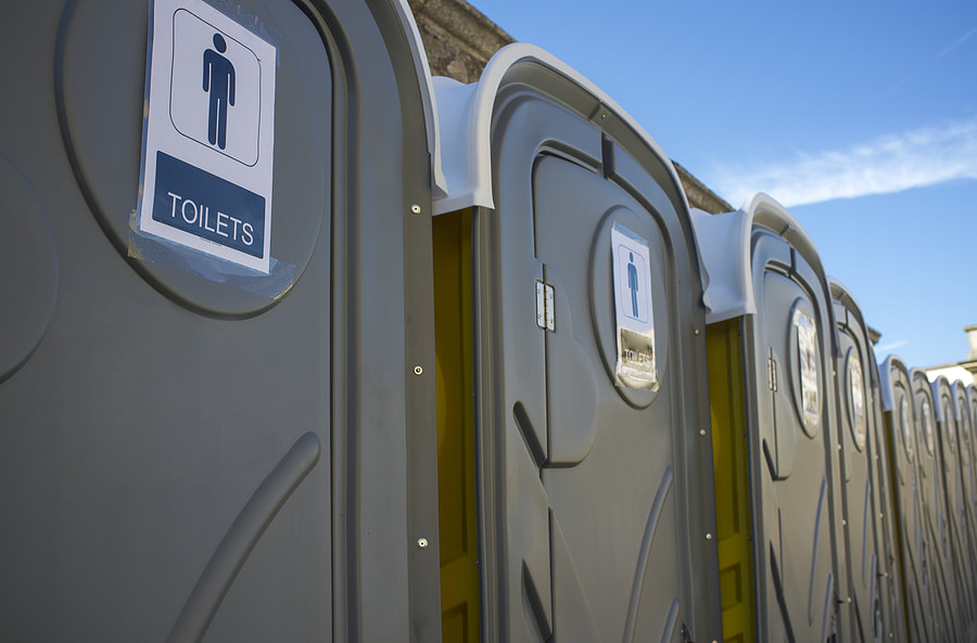 portable toilets with signs